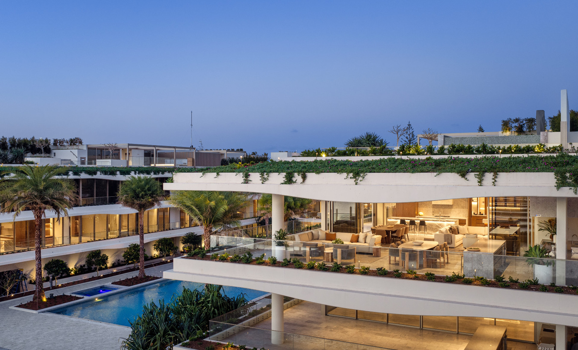 Aerial view of The Mantaray's rooftop pool terrace, landscaped gardens and waterfront frontage